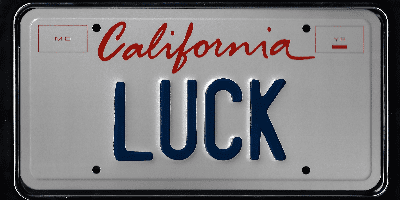 A california license plate with the word " luck " written on it.