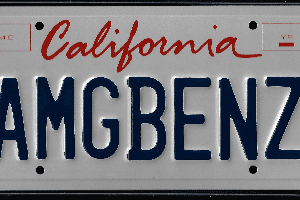 A california license plate with the word " mcben " written on it.