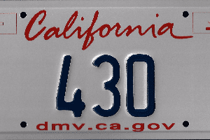 A california license plate with the number 4 3 0.