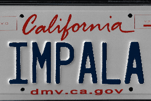 A california license plate with the word " impala " written on it.