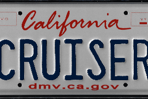 A california license plate with the word " cruise " written in red and blue.