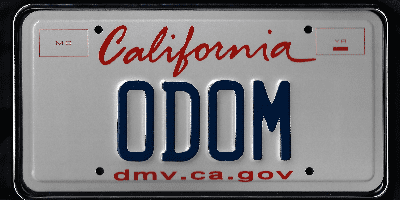 A california license plate with the word " odom ".